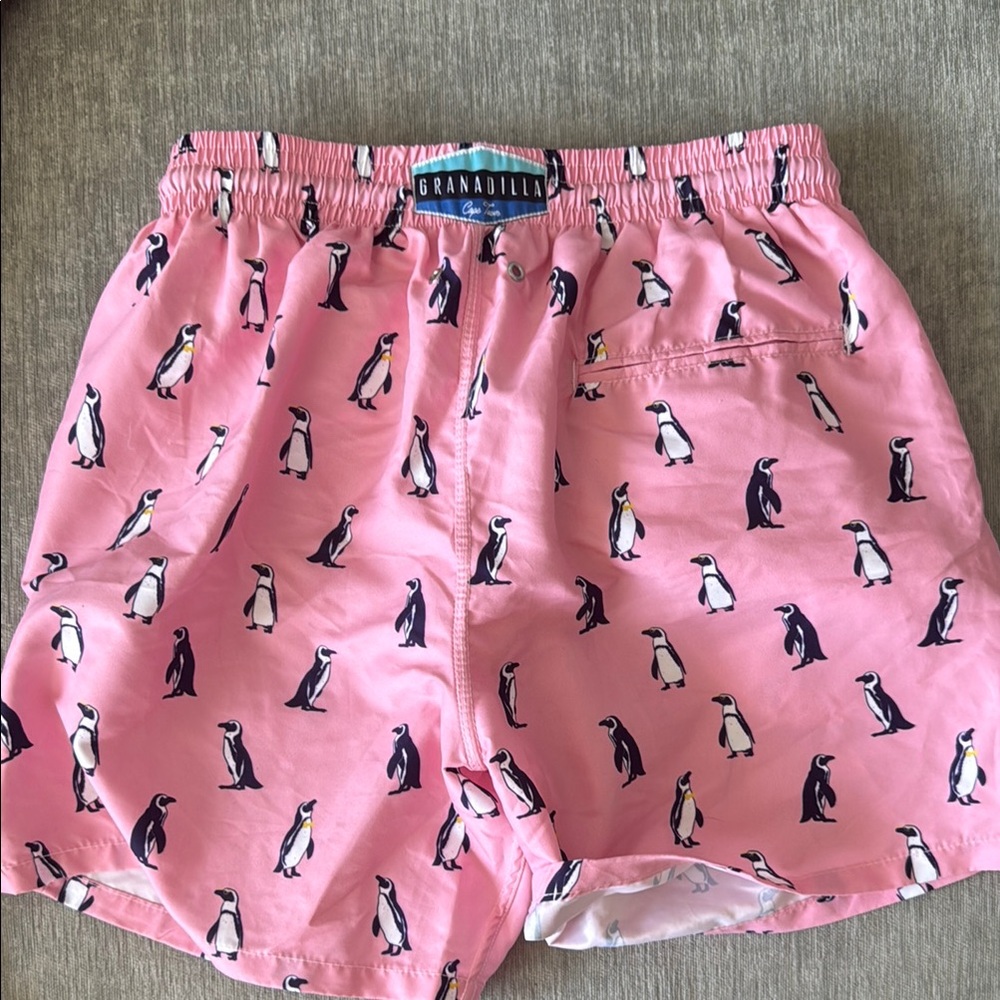 Pink Penguin Swim Trunks